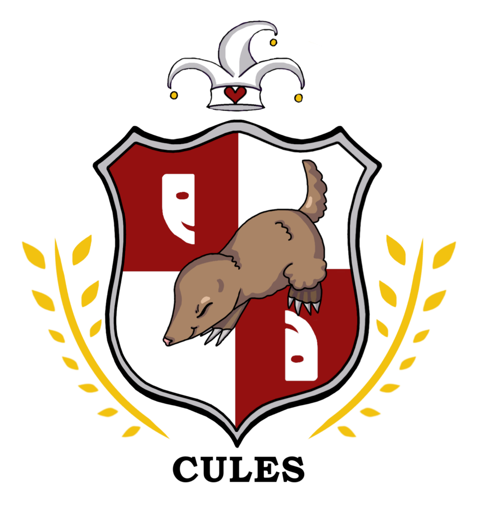 The CULES red and white crest, with a jester hat over the top, and a cute mole in the middle. There are theatre half-masks on the crest, one upside down but both smiling